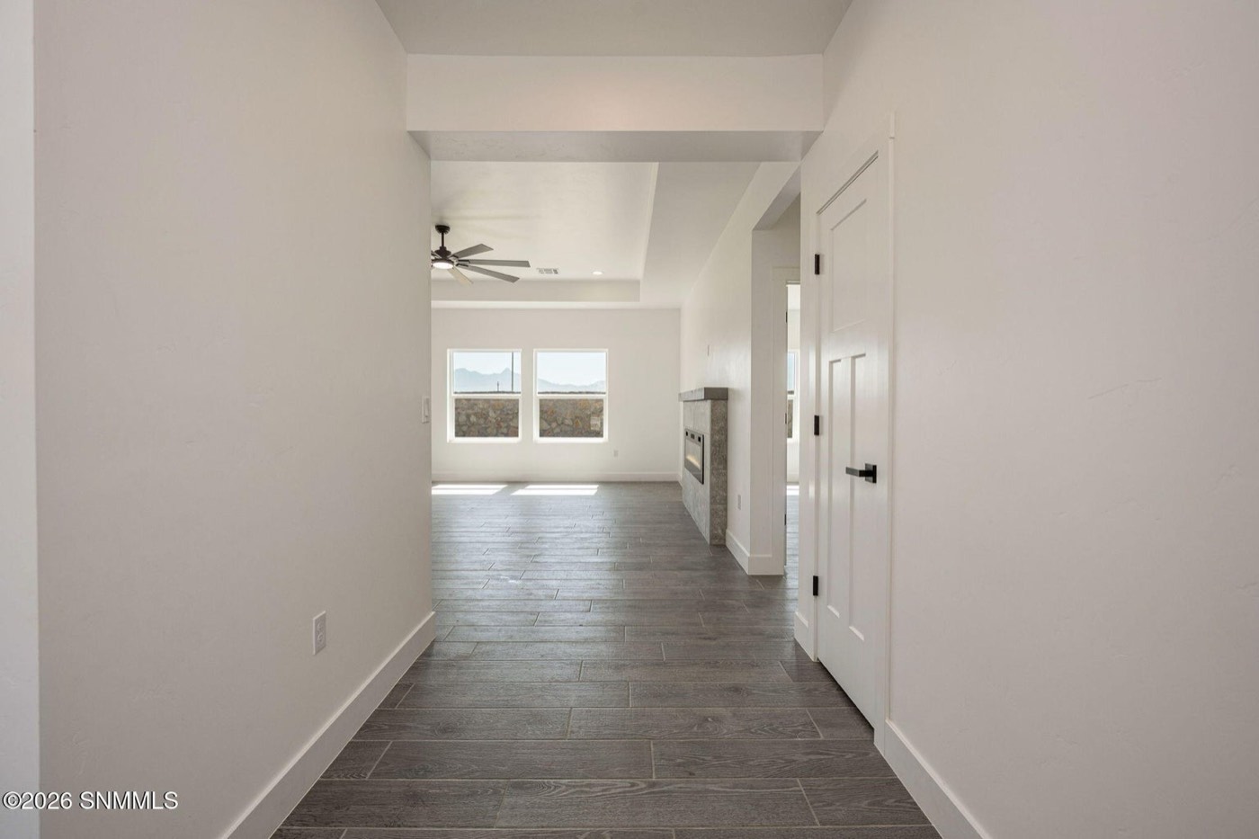 Tile flooring running through the hallway and living area of an MD home