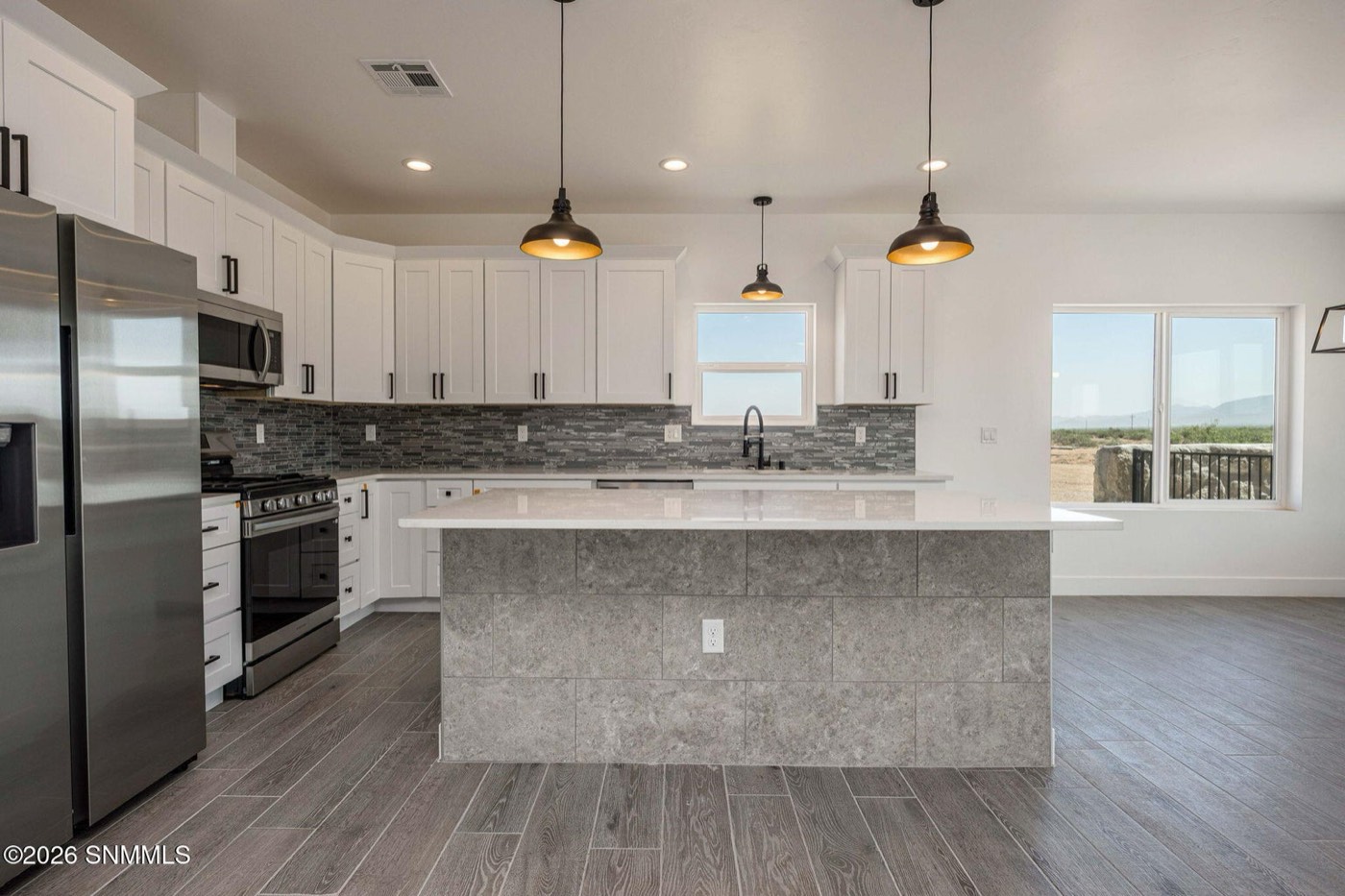 The Sofia floor plan kitchen with quartz island and mountain views